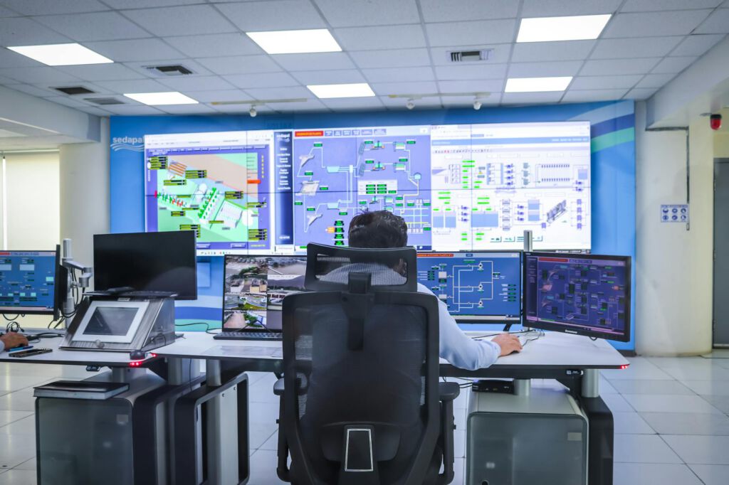 A professional IT consultant reviewing network security protocols on a tablet in a modern Girard office, cinematic lighting.